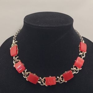 Red thermoset lucite moonglow square necklace.